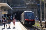 A Hitachi "Rock" EMU departs Riomaggiore for points South